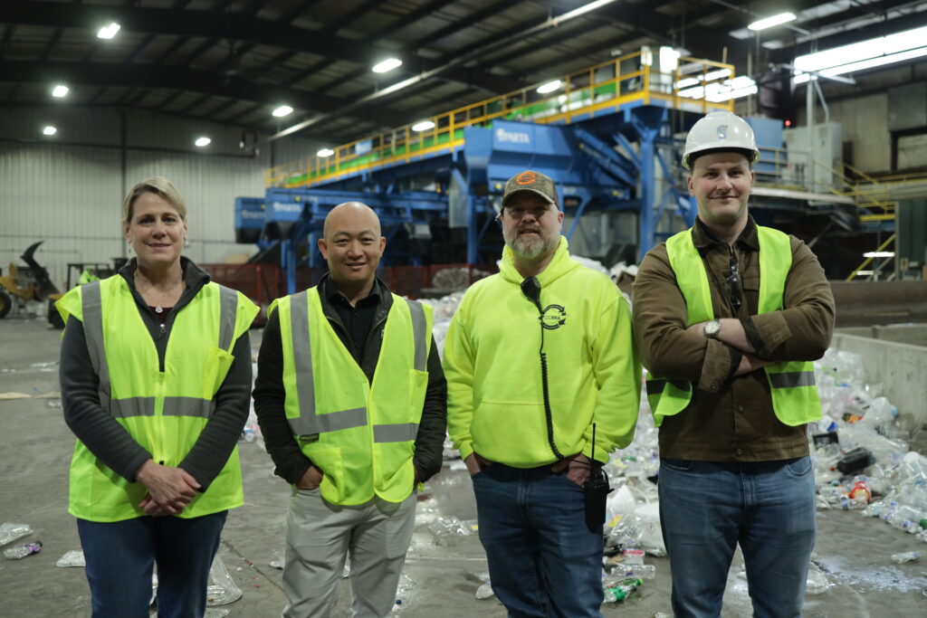 CCRRA team standing inside a recycling facility featuring Sparta and Alchemy AI-powered sorting technology as part of a recycling system upgrade.