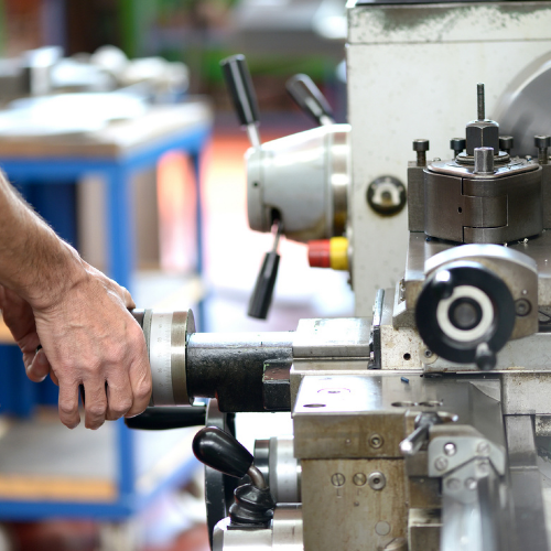 Sparta Manufacturing - Passion. Expertise. Flexibility. | Careers at Sparta Manufacturing | Jobs in New Brunswick CNC lathe operator machining a precision metal component at Sparta Manufacturing's New Brunswick facility.