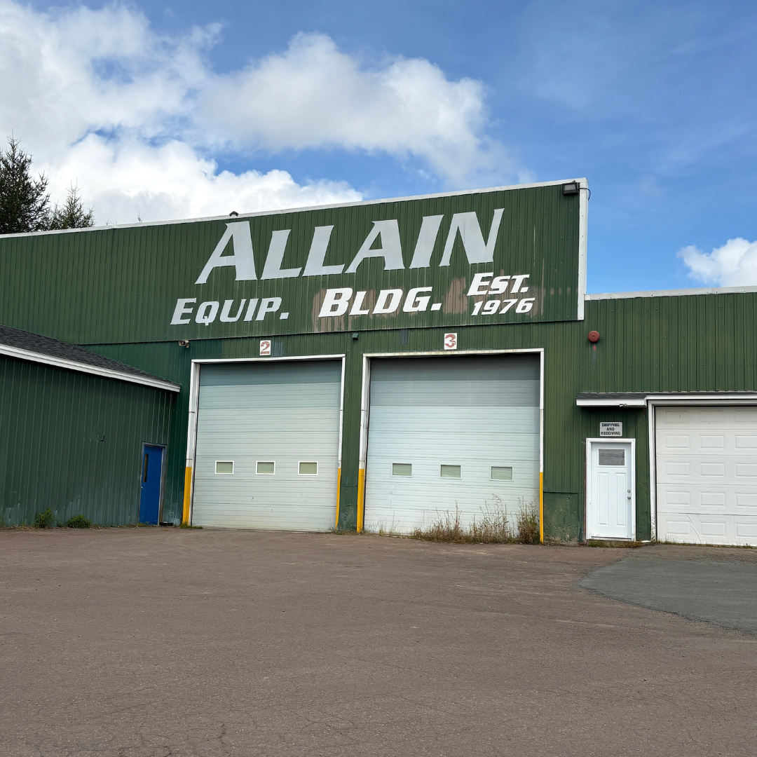 Original Allain Equipment building in Notre-Dame, New Brunswick, with its historic company signage
